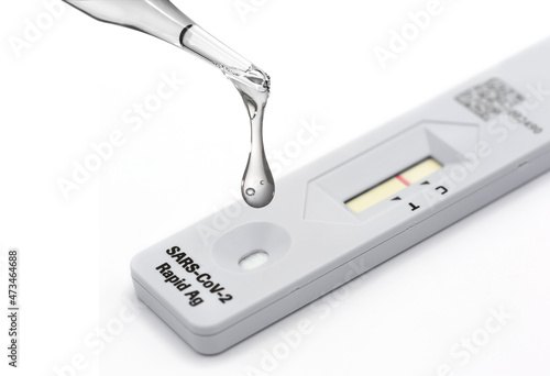 Sample from nazal swap dropping on the Rapid Antigen Test kit for viral disease Covid-19 with Negative result photo