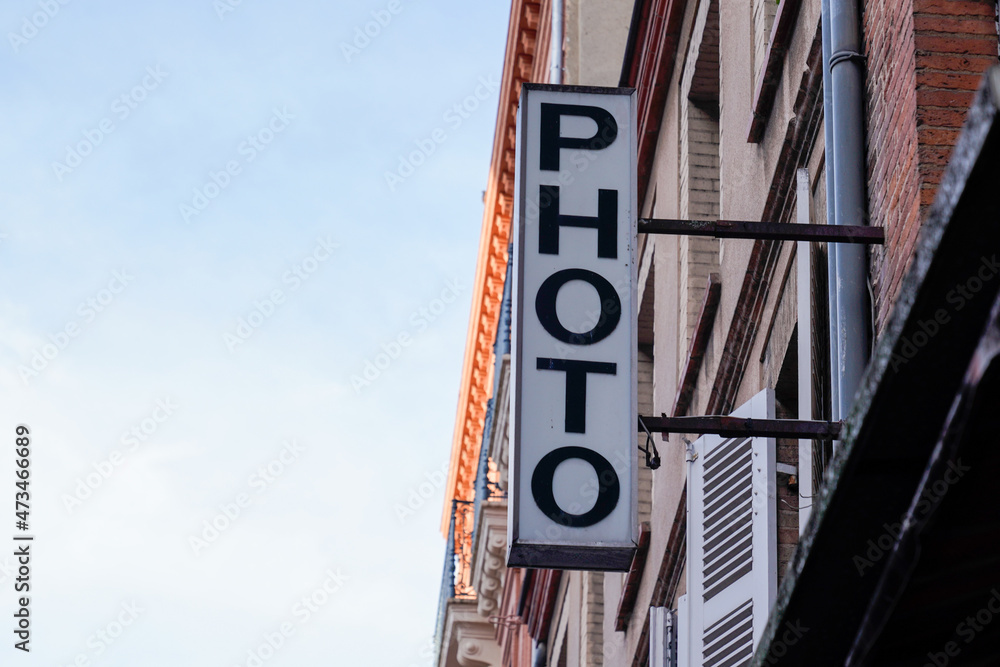 photo sign text front of store photograph picture shot agency shop of camera photo sign text front of store photograph picture shot agency shop of camera