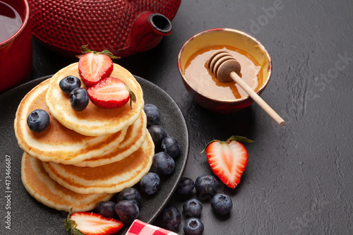 Healthy breakfast with pancakes and herbal tea
