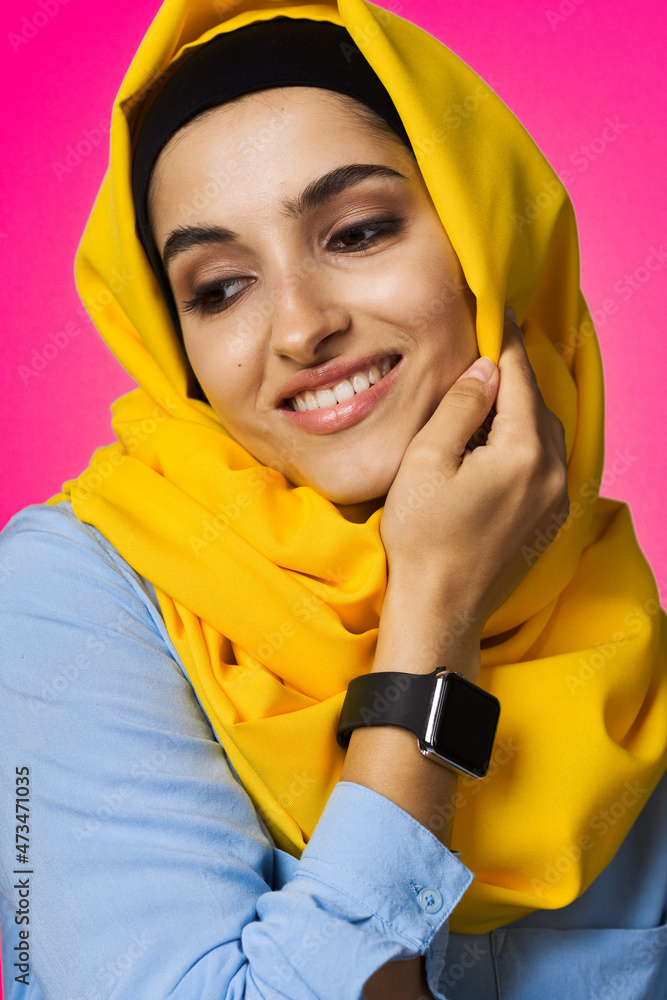 muslim woman with smart watch technology posing pink background muslim woman with smart watch technology posing pink background