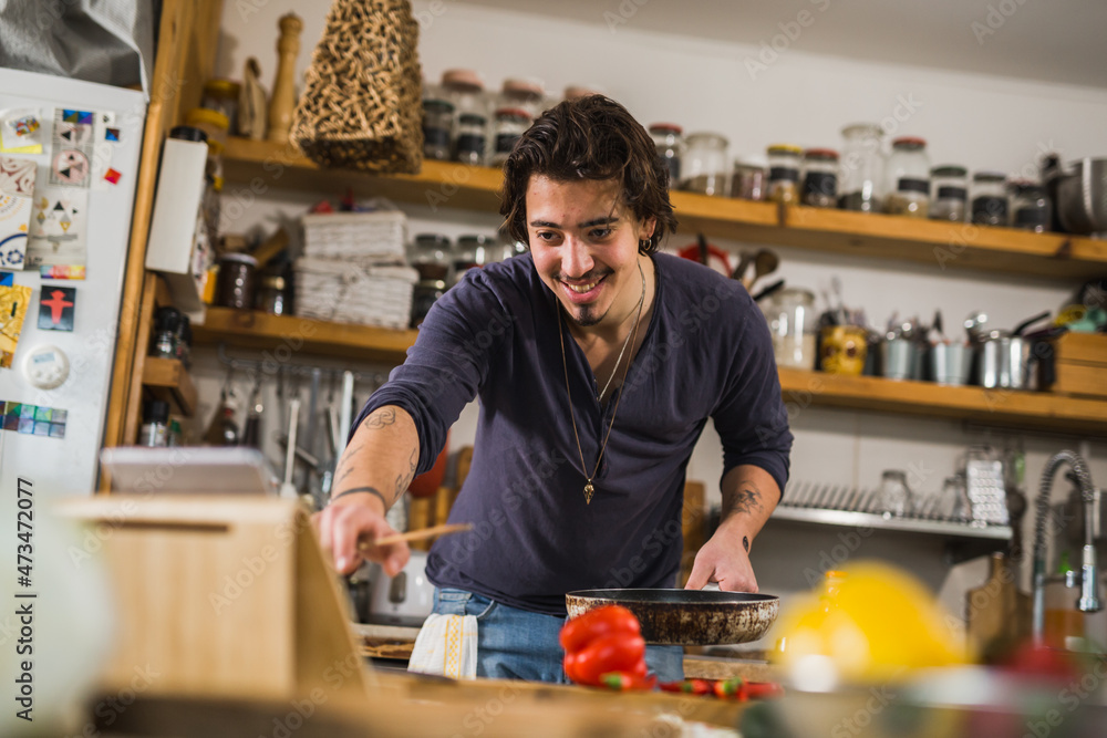 man learns to cook in his kitchen man learns to cook in his kitchen