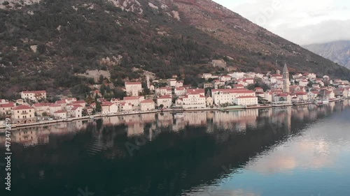 Panoramic parallax of Perast city, sky and mountains