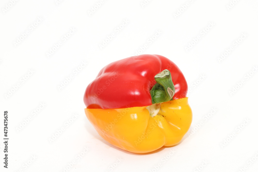 organic red and yellow bell peppers isolated on white background. organic red and yellow bell peppers isolated on white background.