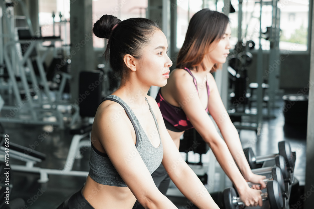 asia group friends working out or exercise and wearing sportswear in fitness or gym center, strength sporty and weight loss concept asia group friends working out or exercise and wearing sportswear in fitness or gym center, strength sporty and weight loss concept