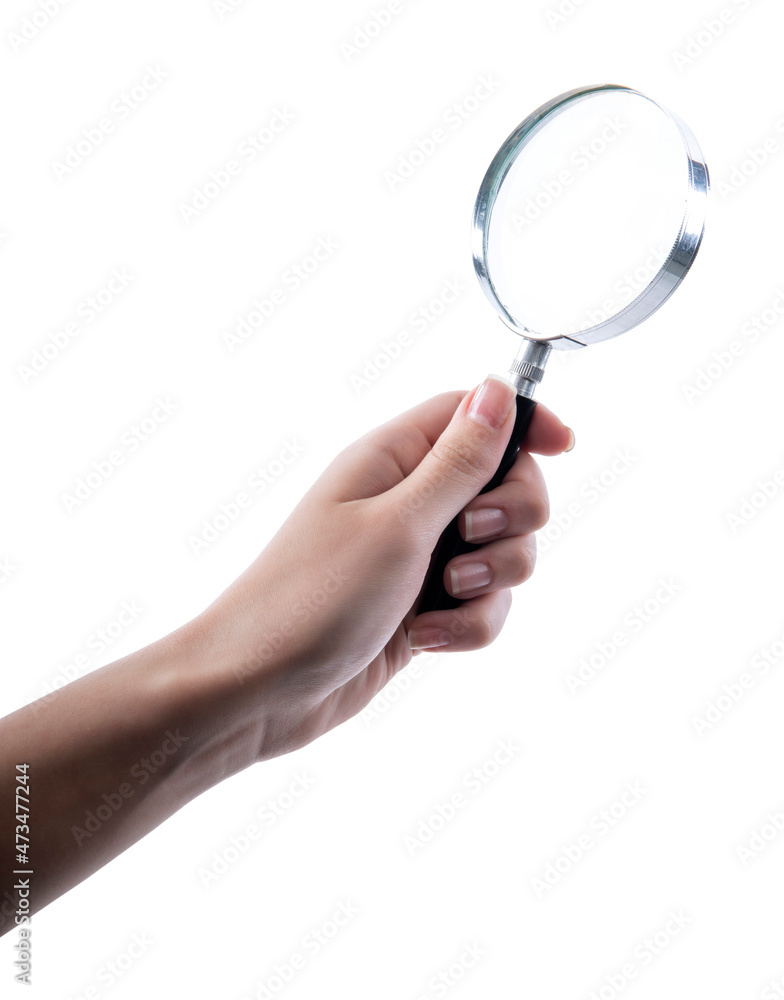 Hand holding magnifying glass isolated on white background Hand holding magnifying glass isolated on white background