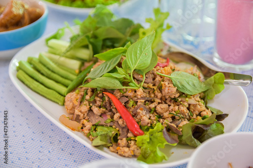 Spicy minced pork with red chili peppers and vegetables, Or Lab-Moo in Thailand food