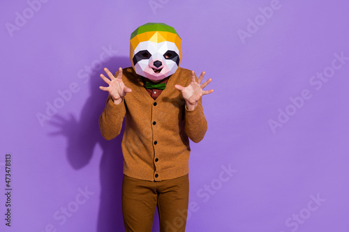 Photo of wacky slow sloth mask person arms palms make claws isolated on purple color background photo