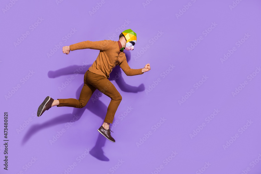 Full size profile portrait of active energetic red panda mask guy running isolated on violet color background Full size profile portrait of active energetic red panda mask guy running isolated on violet color background