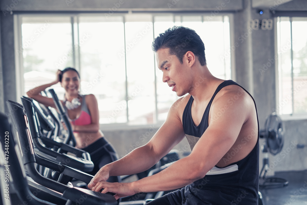 Obraz premium asia group friends working out or exercise and wearing sportswear in fitness or gym center, strength sporty and weight loss concept