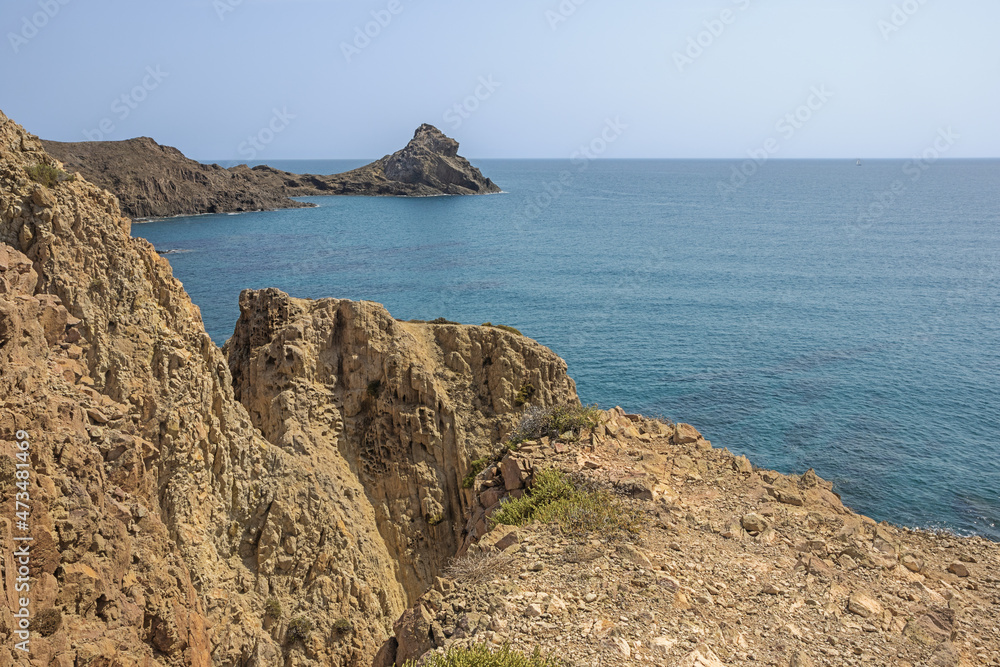 Standing on the cliffs at the Cabo de Gata, seen from the Las Sirenas lookout