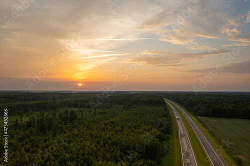 Aerial summer evening stormy view of highway road, before the storm