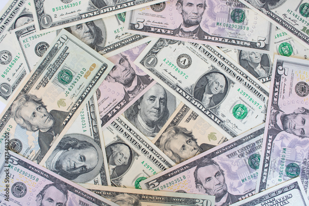 A pile of US banknotes. Cash of dollar bills, dollar background image