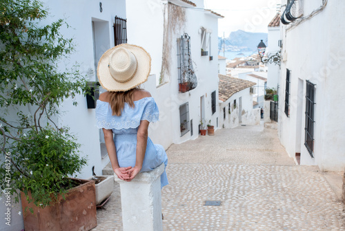 Anonymous woman on street of old coastal town in Altea photo
