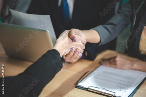 business people are shaking...