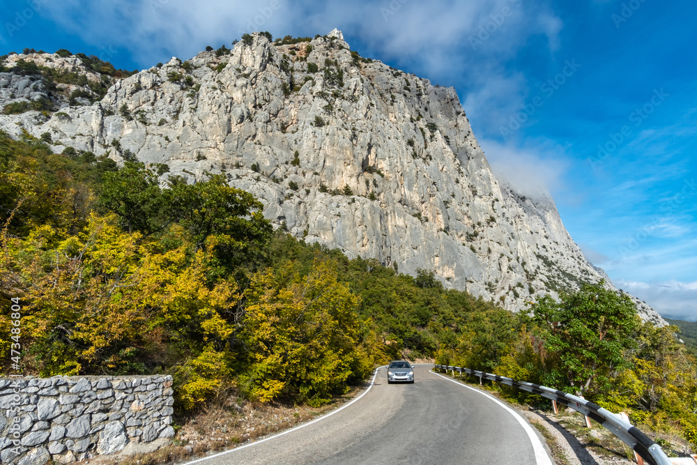 Mountain serpentine under a high cliff on the southern coast of Crimea