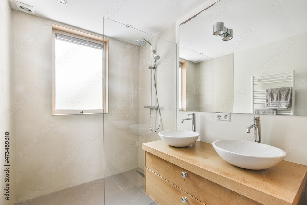 Bathroom with sinks and washing machines Bathroom with sinks and washing machines