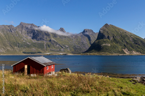 red wooden fisher stilt house at fjord in lofoten island norway europe