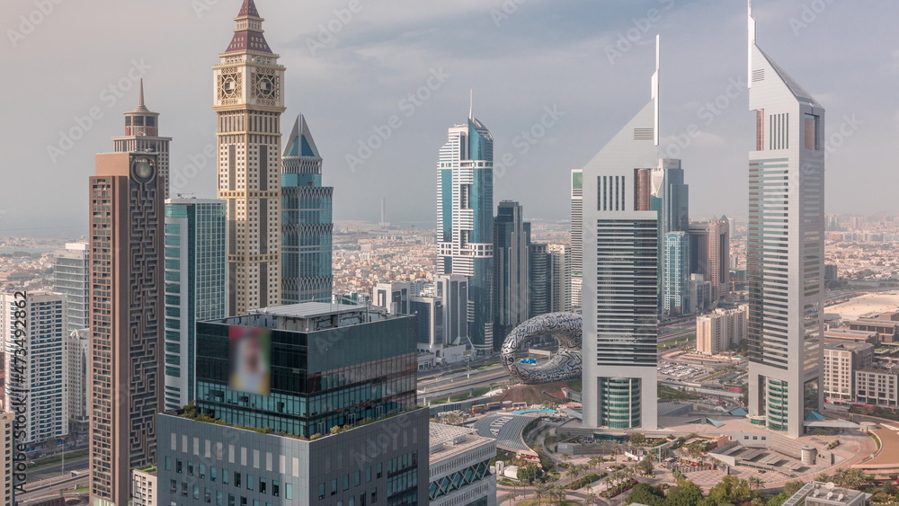Fototapeta premium Skyscrapers on Sheikh Zayed Road and DIFC timelapse in Dubai, UAE.