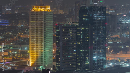Photography Aerial view of skyscrapers with World Trade center in Dubai night timelapse