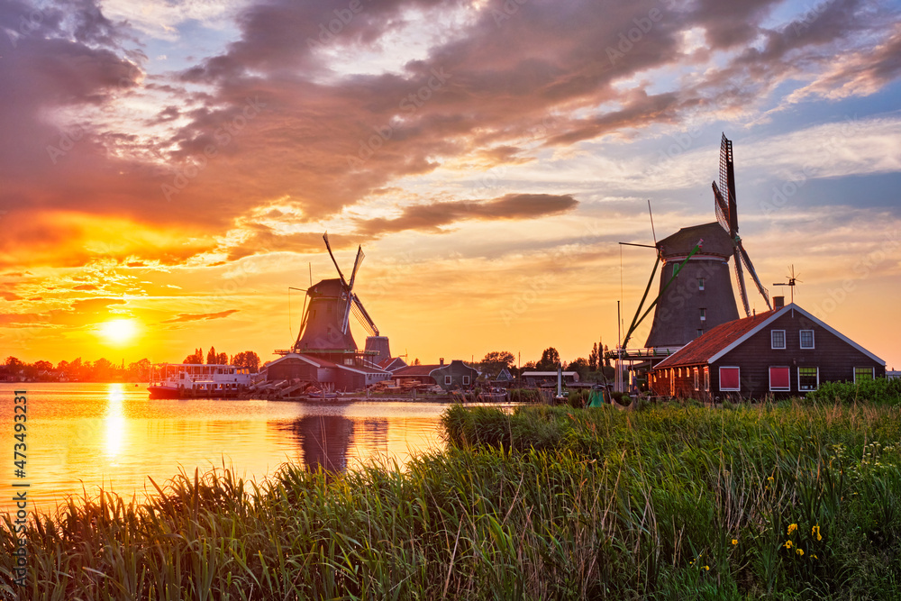 Windmills at Zaanse Schans in Holland on sunset. Zaandam, Nether Windmills at Zaanse Schans in Holland on sunset. Zaandam, Nether
