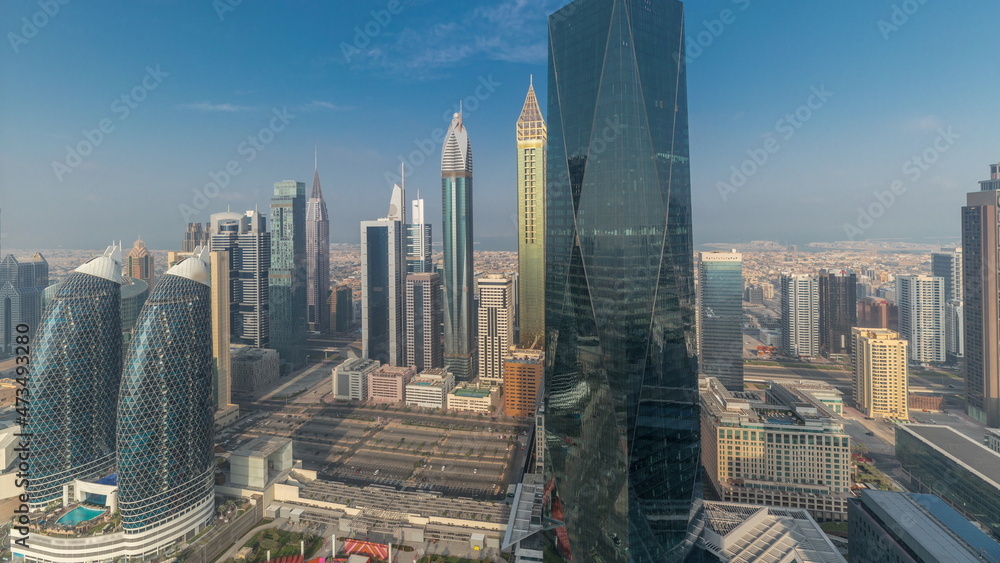 Obraz premium Panorama of futuristic skyscrapers in financial district business center in Dubai on Sheikh Zayed road timelapse