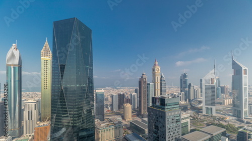 Panorama of futuristic skyscrapers in financial district business center in Dubai on Sheikh Zayed road timelapse