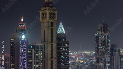 Skyscrapers on Sheikh Zayed Road and DIFC night timelapse in Dubai  UAE.