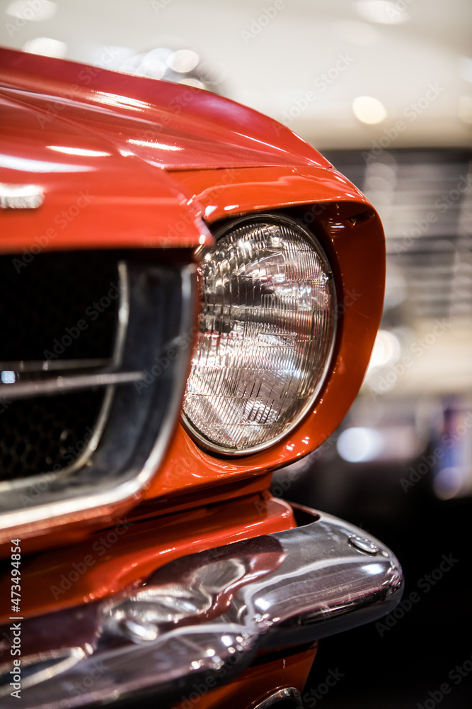 Turn signal and headlight of a retro red car