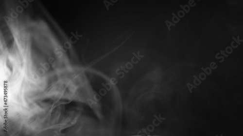 white smoke on a black background. Slow motion. Vape smoke