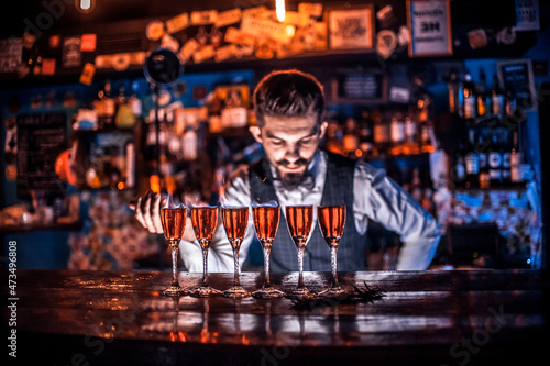 Barman concocts a cocktail on the pothouse