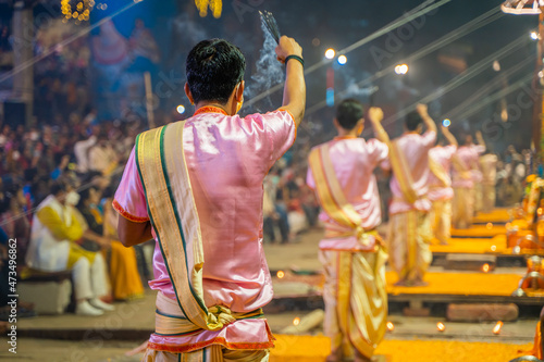 Ganga aarti ceremony rituals were performed by Hindu priests at Dashashwamedh Ghat and Assi Ghat in Varanasi Uttar Pradesh India photo