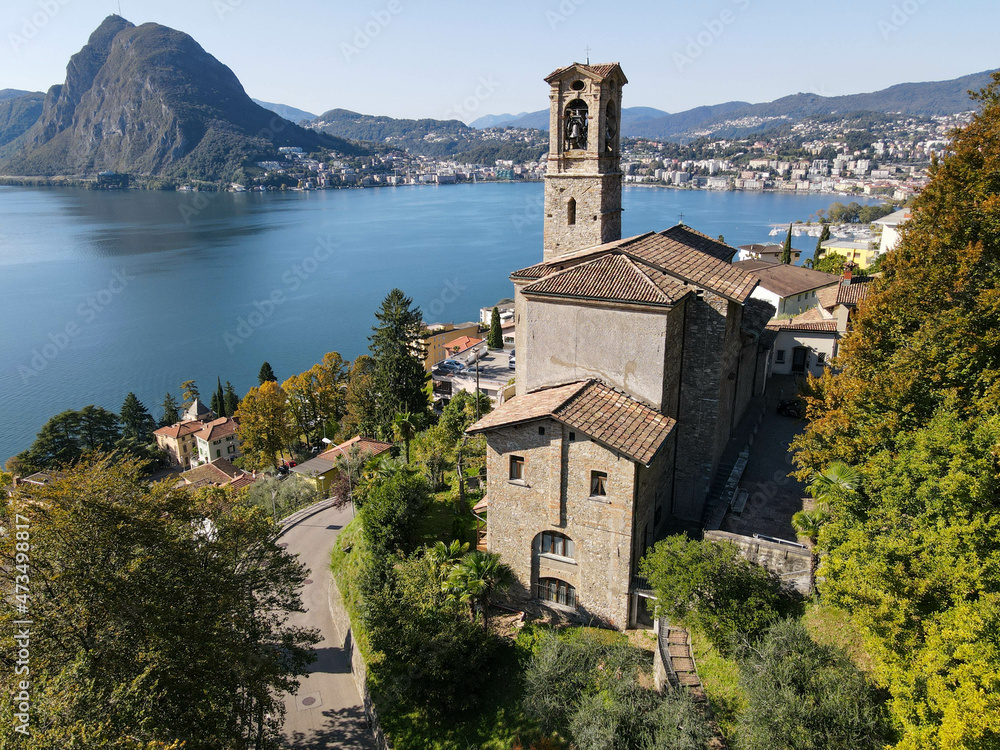 Drone view at St. George church and the bay of Lugano on the italian part of Switzerland