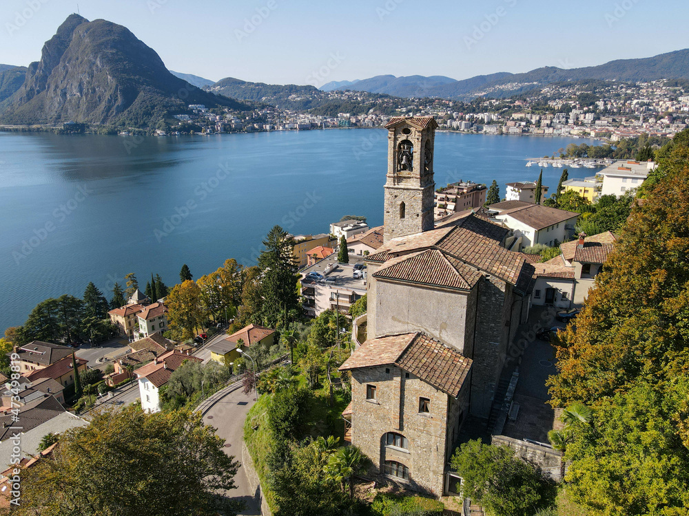 Drone view at St. George church and the bay of Lugano on the italian part of Switzerland