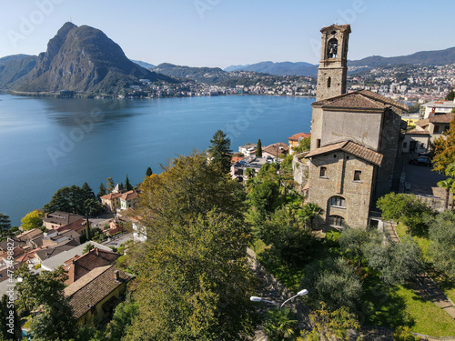 Drone view at St. George church and the bay of Lugano on the italian part of Switzerland