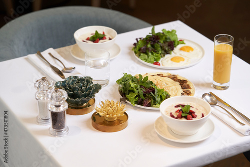 Restaurant breakfast table served with food