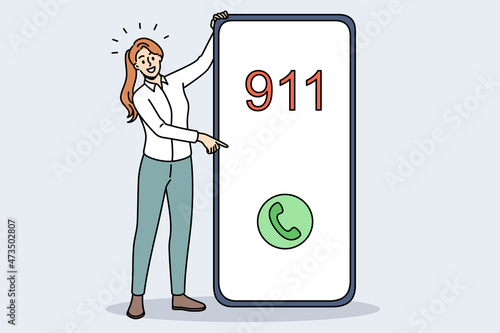 Emergency call and sos concept. Smiling woman standing near huge smartphone pointing at screen with 911 emergency green button call vector illustration 