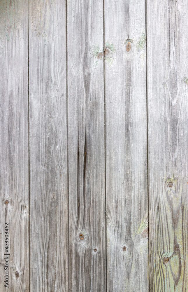 Old grey wooden background with cracks and scratches in vintage style Old grey wooden background with cracks and scratches in vintage style