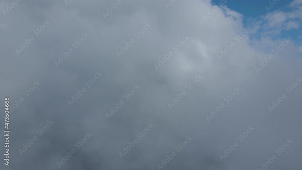Aerial view at high altitude of dark cumulus clouds forming before rainstorm Aerial view at high altitude of dark cumulus clouds forming before rainstorm