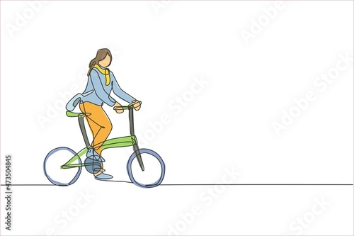 One single line drawing young happy startup employee woman ride bicycle to the coworking space vector illustration graphic. Healthy commuter urban lifestyle concept. Modern continuous line draw design