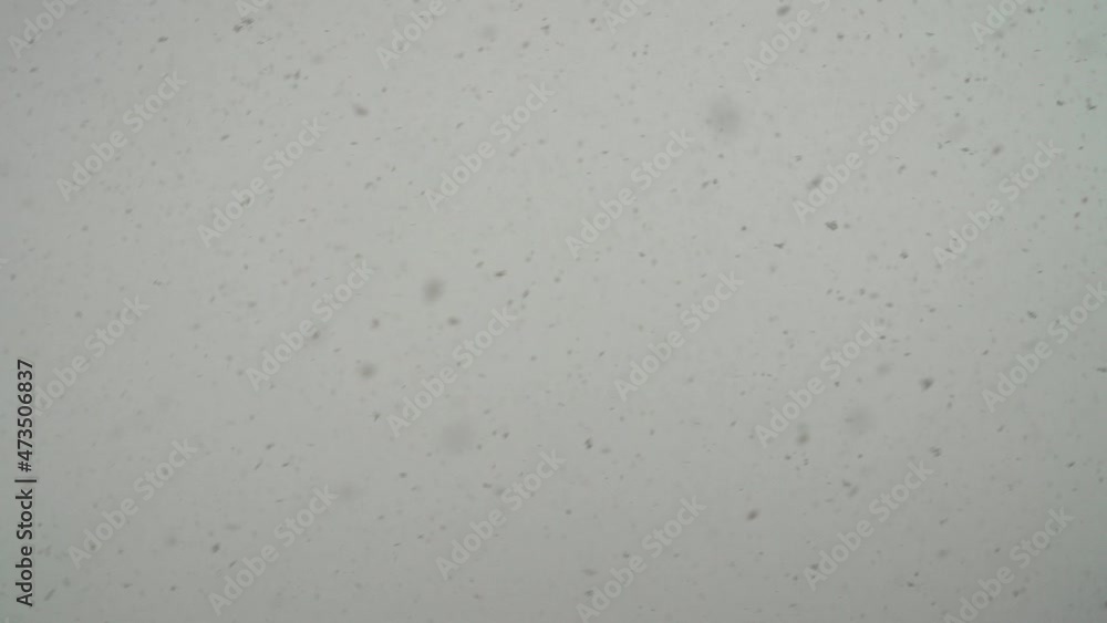 Snow falling over sky background at wintertime. Snow falling over sky background at wintertime.