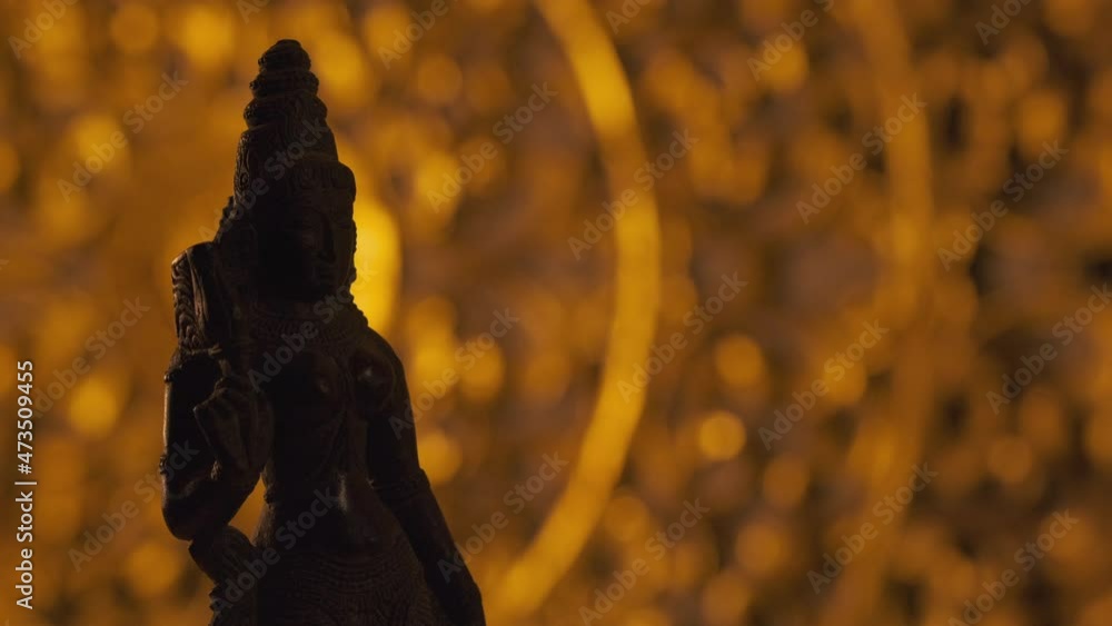Statue of Parvati goddess, wife of Shiva, Hinduism religion. Turntable, light fading in, turning on beam. Statue of Parvati goddess, wife of Shiva, Hinduism religion. Turntable, light fading in, turning on beam.