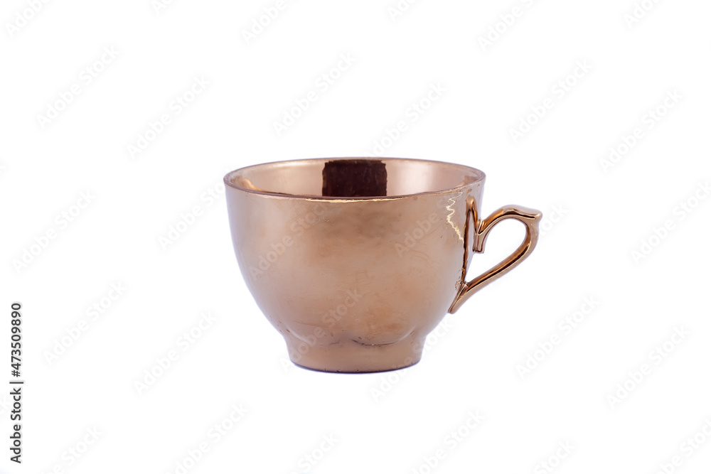 Ceramic gold cup isolated on white background. Copy space. Ceramic gold cup isolated on white background. Copy space.
