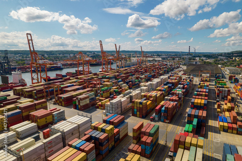 Obraz na płótnie Port of Gdynia. Seaport, containers, container ships and sea transport from the bird's eye view on a sunny day. w salonie