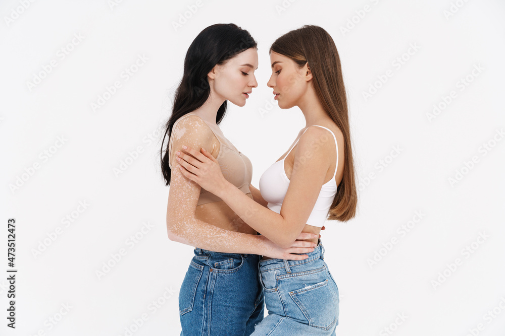 Two young woman in underwear standing together Two young woman in underwear standing together