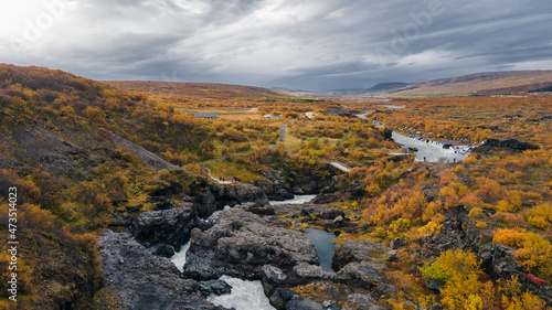 Aeril view to from Hraunfossar in autumn with red leaves