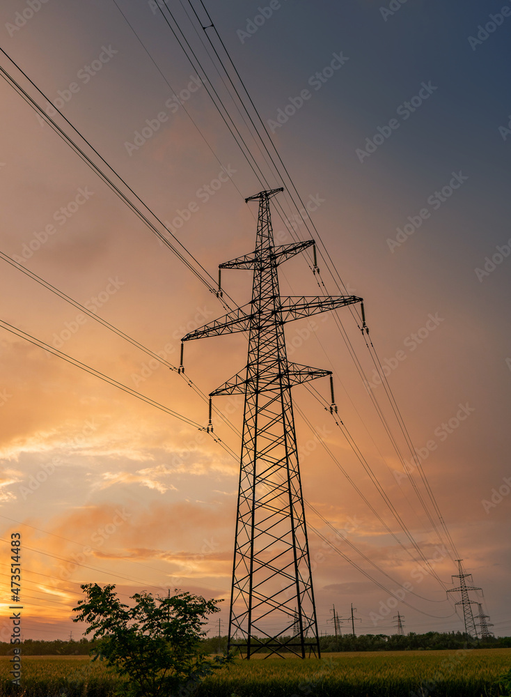 High-voltage power lines on the background of a beautiful cloudy sky