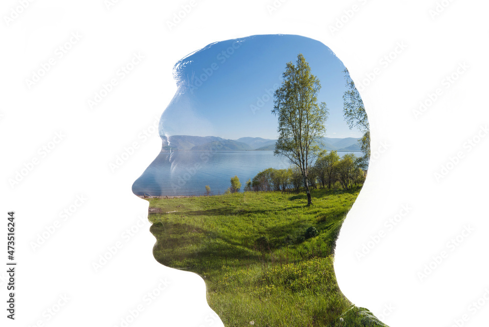Combination of a silhouette of a face and a landscape. Concept of the connection between man and nature