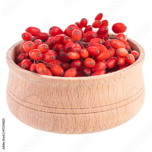 barberries in wooden cup isolated on white background
