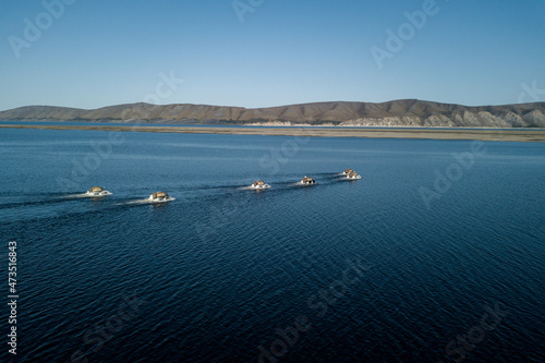 Amphibious offroad vehicles crossing the Lena river  © Артем Ачкасов