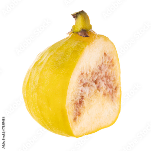 single half of yellow fig isolated on white